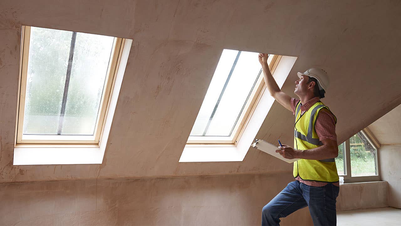 Man inspecting windows in a home inspection