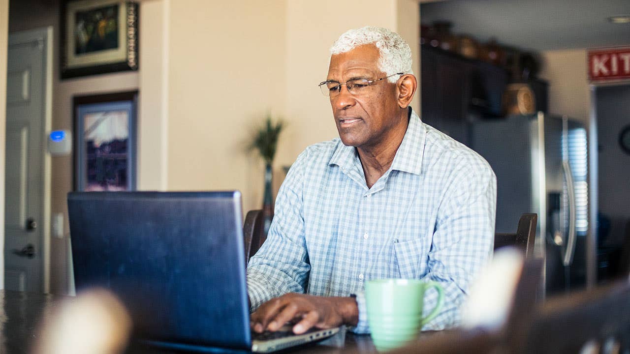 Man using laptop at home