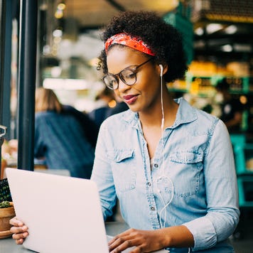 A woman does research online.