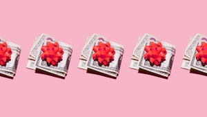 Row of folded dollar bills with red gift bows