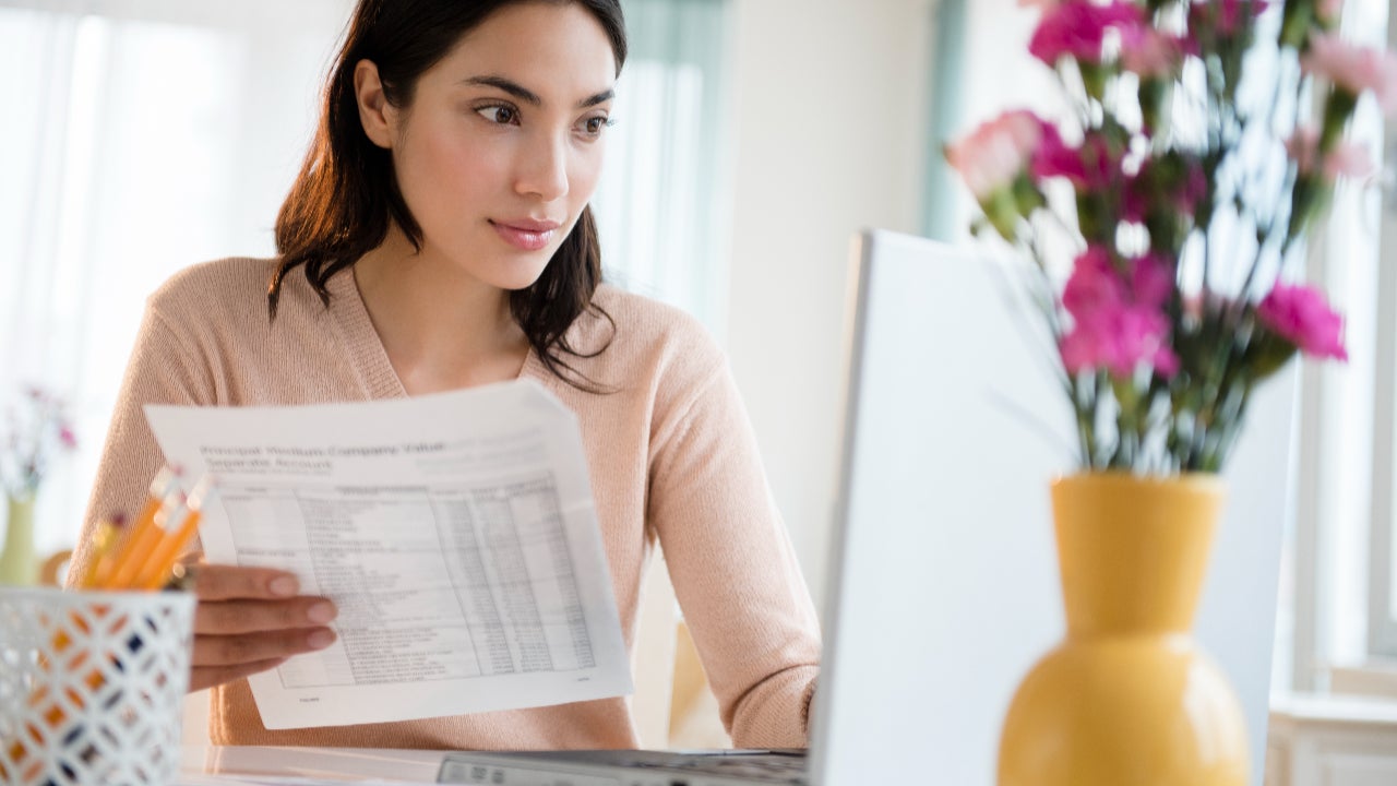 Person paying bills on laptop