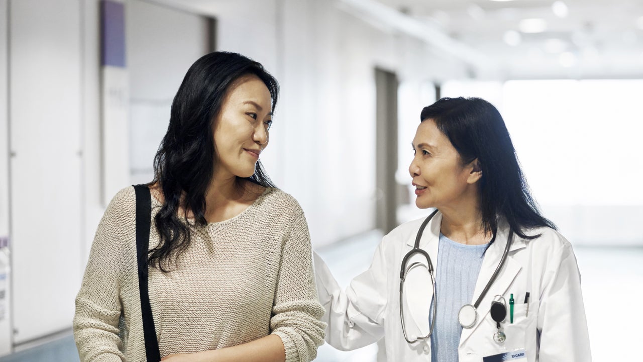 A woman consulting her health specialist.