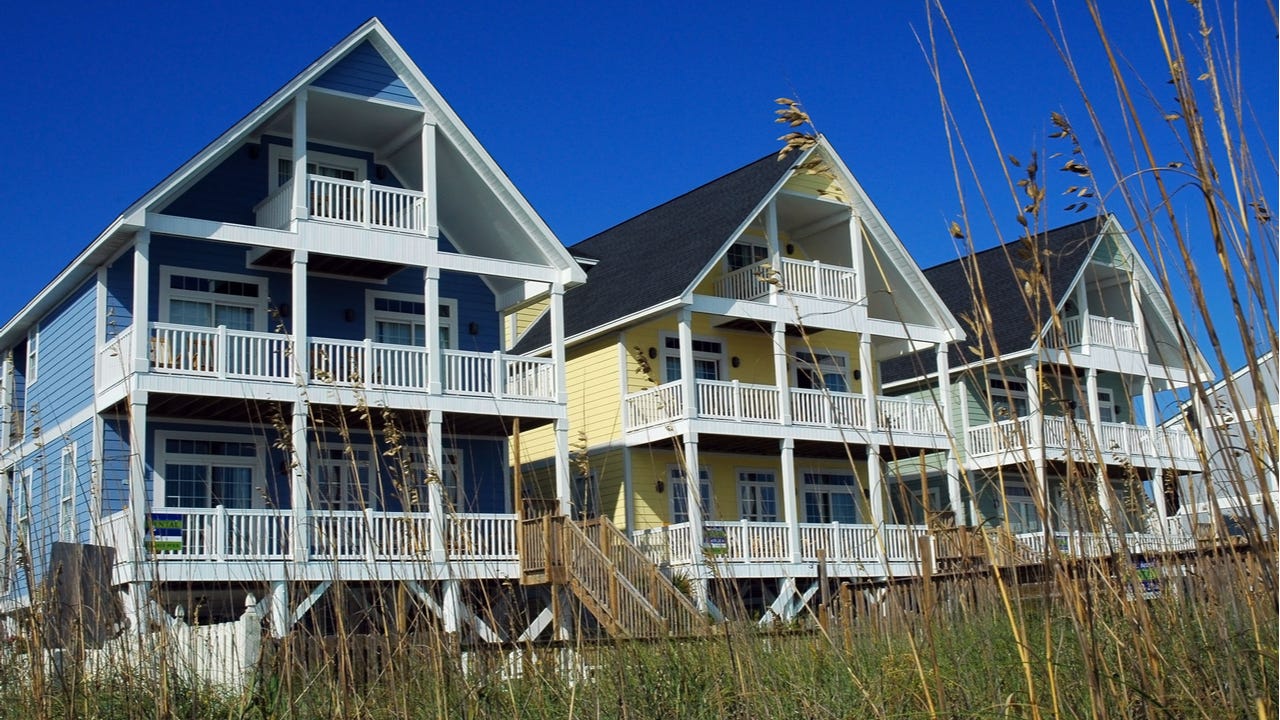 A group of waterfront homes with a shared beach