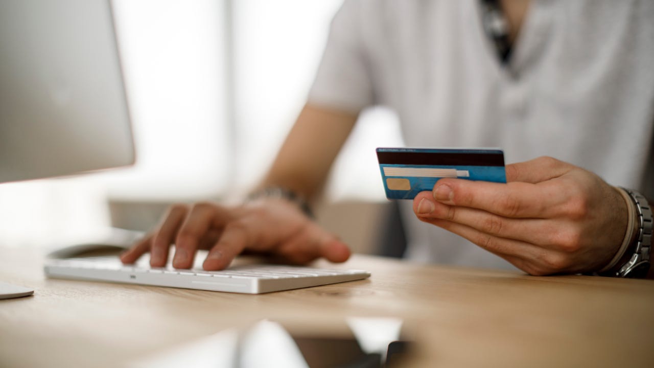 Person holding credit card