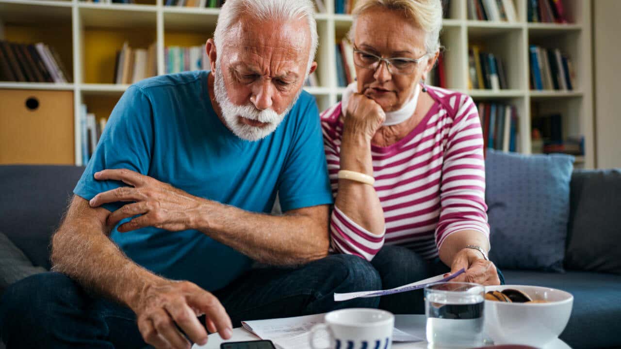 Senior couple managing finances