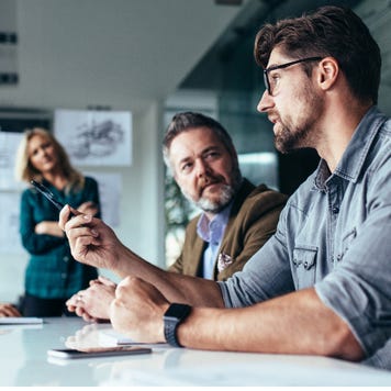 Young man leading a business meeting