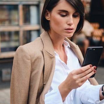 Young woman looking at smartphone