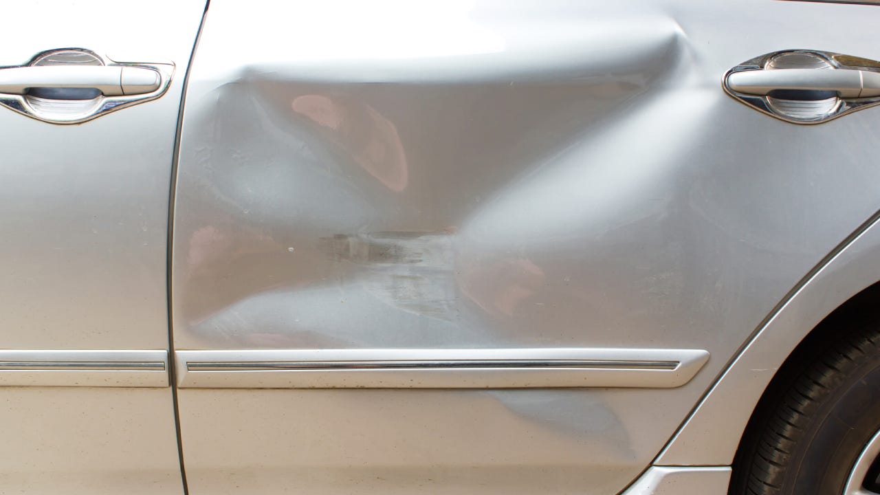 Car crash on back door, passenger seat. Accident of transportation background.