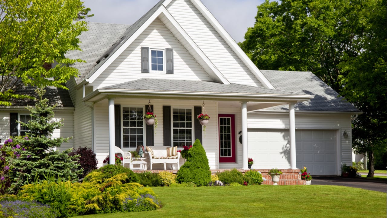 A single-family home with attached garage and landscaping