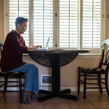 Senior woman using laptop computer at home