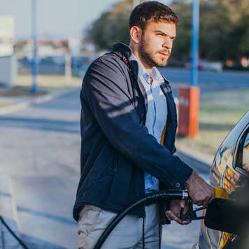 man pumping gas