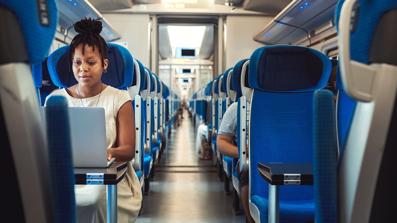 Woman riding on a passenger train