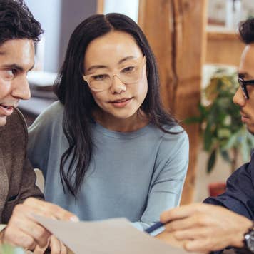 Three people discussing homeownership options