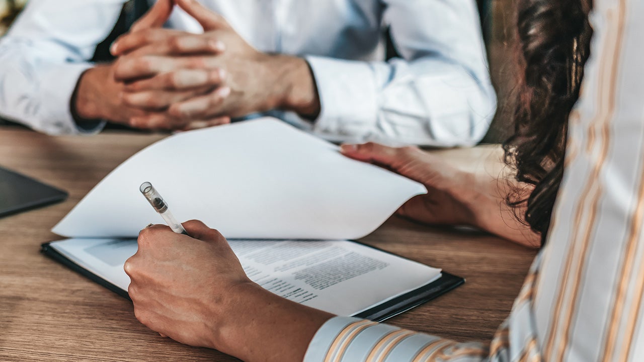 people signing a contract