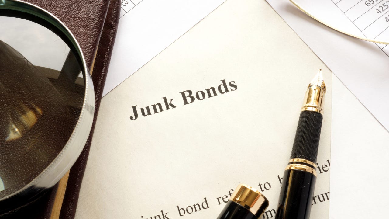 Paper titled "Junk Bonds" and other financial documents.