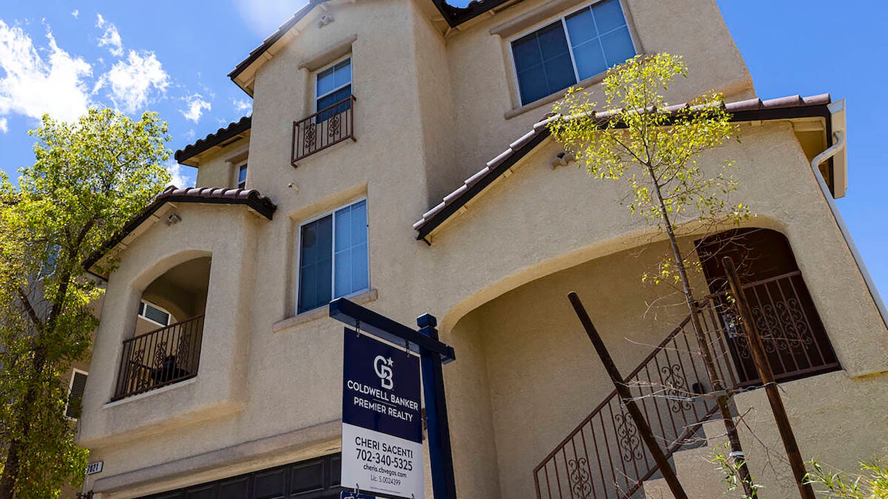 what not to say when selling your house - spanish style home with coldwell banker for sale sign out front