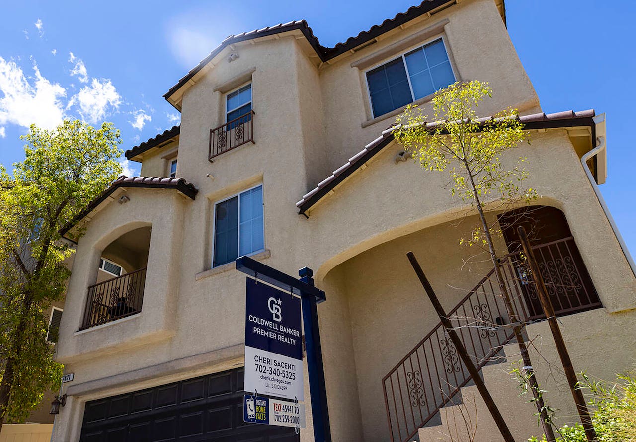 what not to say when selling your house - spanish style home with coldwell banker for sale sign out front