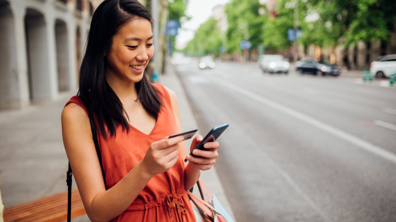 Girl shopping online on the street