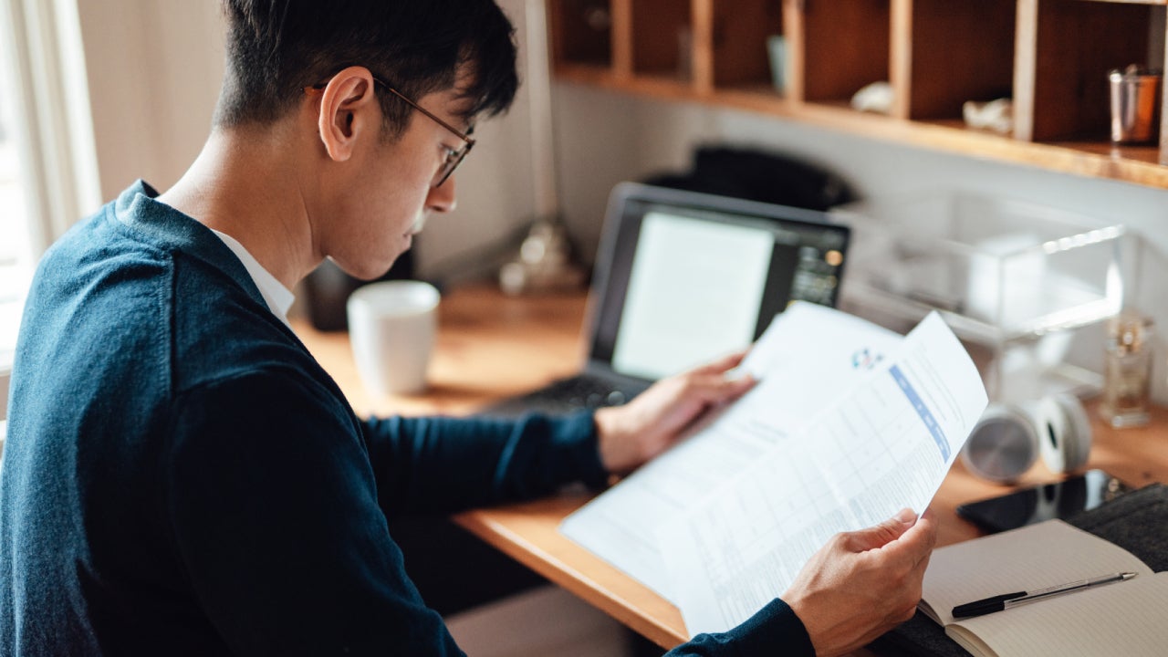 Serious man looking at paperwork
