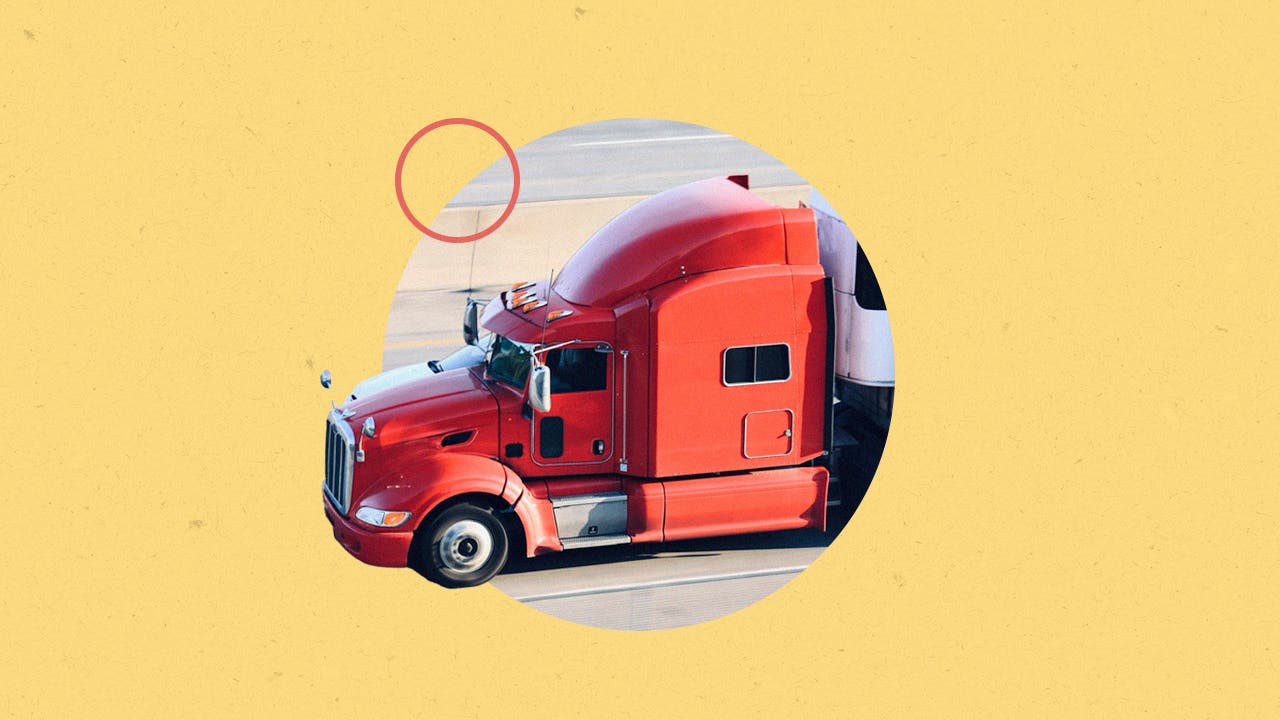 A truck is driving on the road.