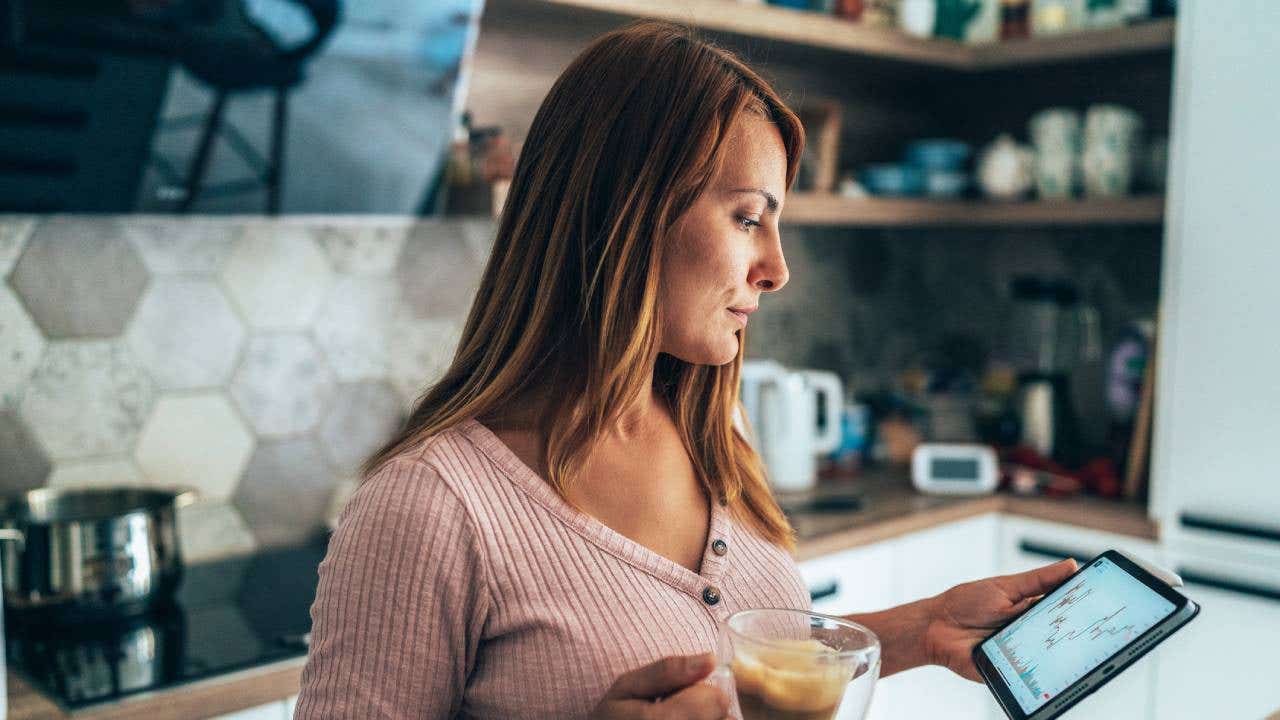 Trader at home using a tablet