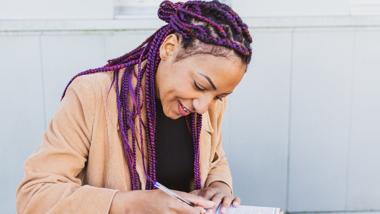 Woman works on business paperwork.