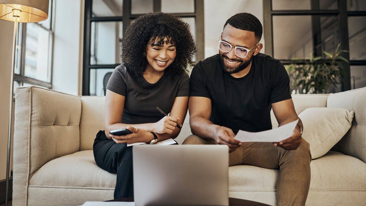 Happy, young and man and woman learning about online investment