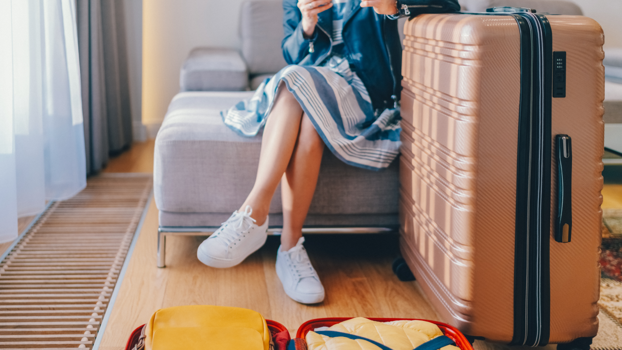 Woman in the hotel texting on smartphone