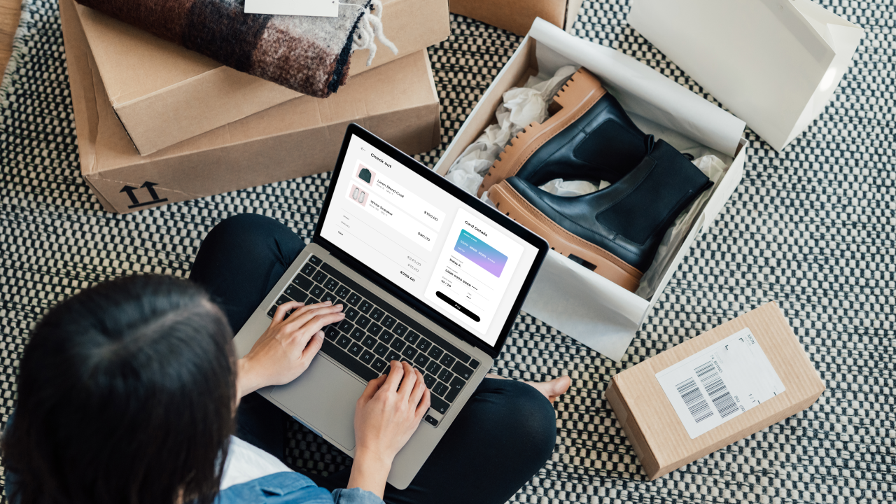 High angle view of young woman making credit card payment while doing online shopping on laptop. Technology makes shopping easier. Mockup image for woman doing online shopping.