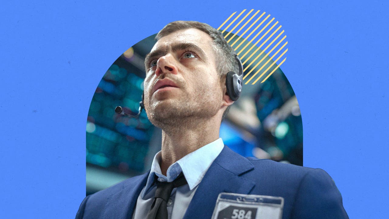 A trader on the stock exchange reacts with surprise