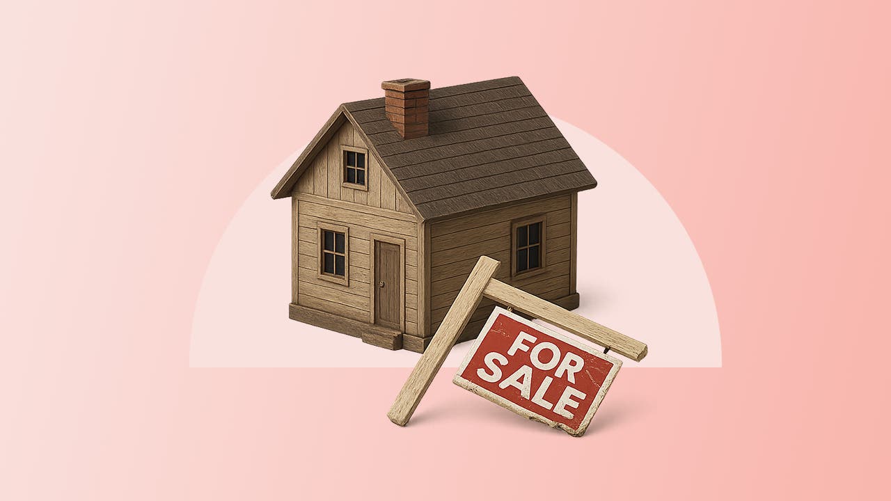 photo illustration of a home with a broken "for sale" sign, pink background