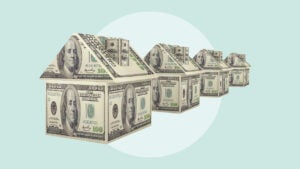 photo illustration of houses made of money