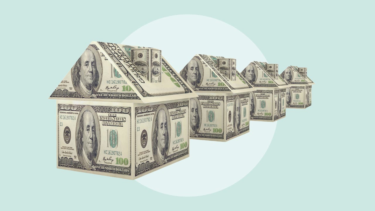 photo illustration of houses made of money