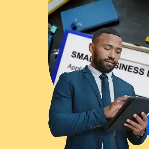 A small business owner applying for a loan on a tablet.