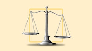 balancing scales on a pale yellow background