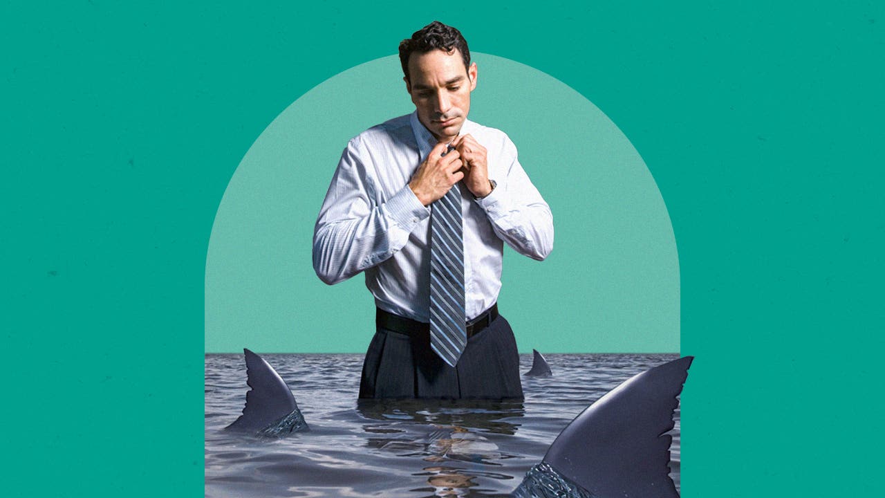 Man adjusting his tie while standing in water