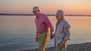A senior couple enjoying summer vacation by the sea