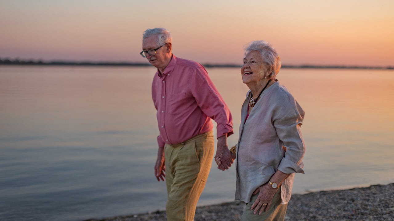 A senior couple enjoying summer vacation by the sea