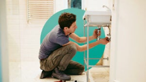 Person doing plumbing