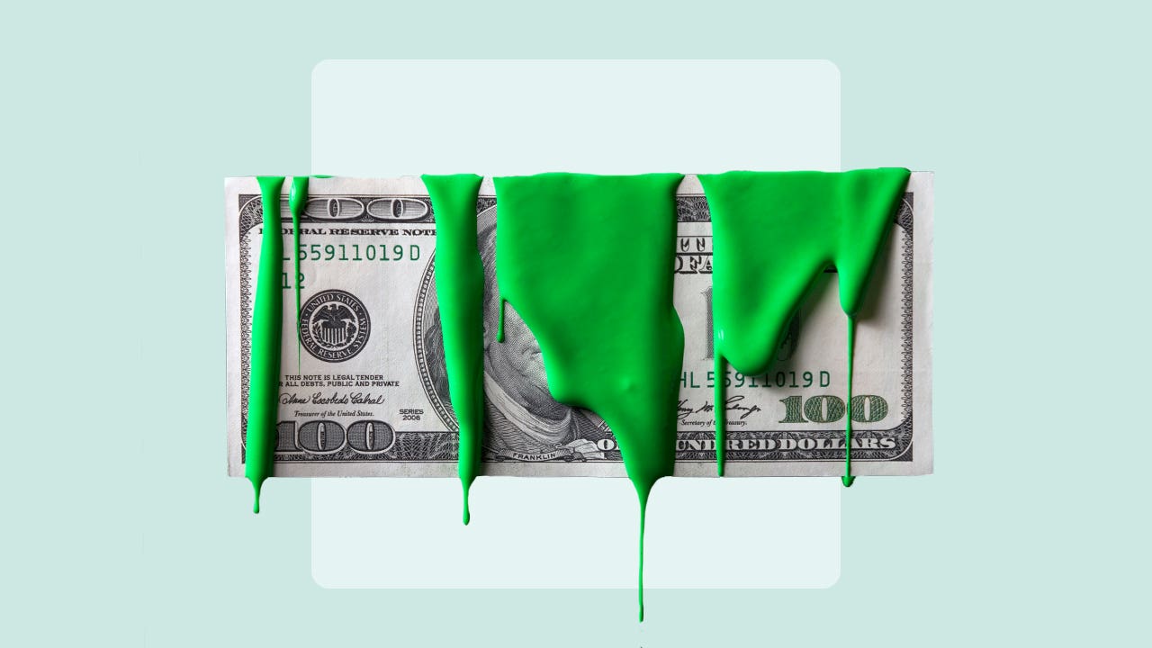 A dollar bill dripping in green paint.