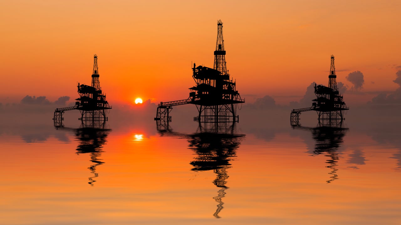 Offshore oil rigs at sunset