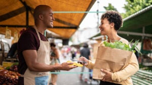 A shop owner talking with a customer