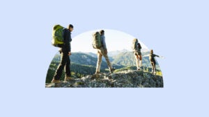 Illustration of hikers walking along mountain