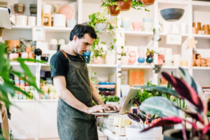 Small-business owner doing inventory in his boutique.
