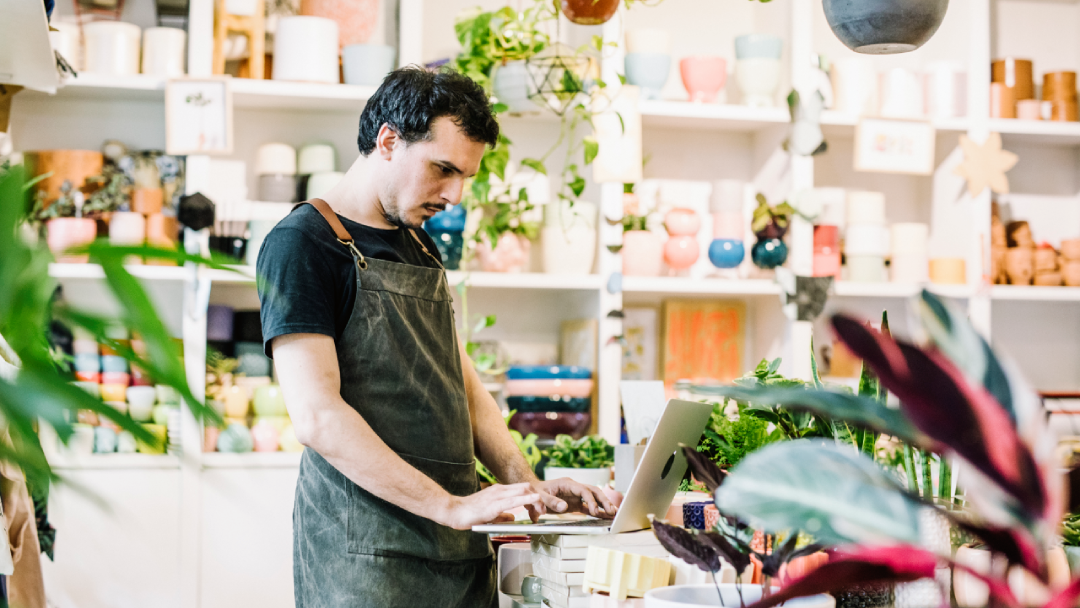 Small-business owner doing inventory in his boutique.