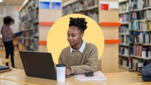 woman working on her laptop in the library