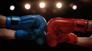Two boxers touching gloves before a match.