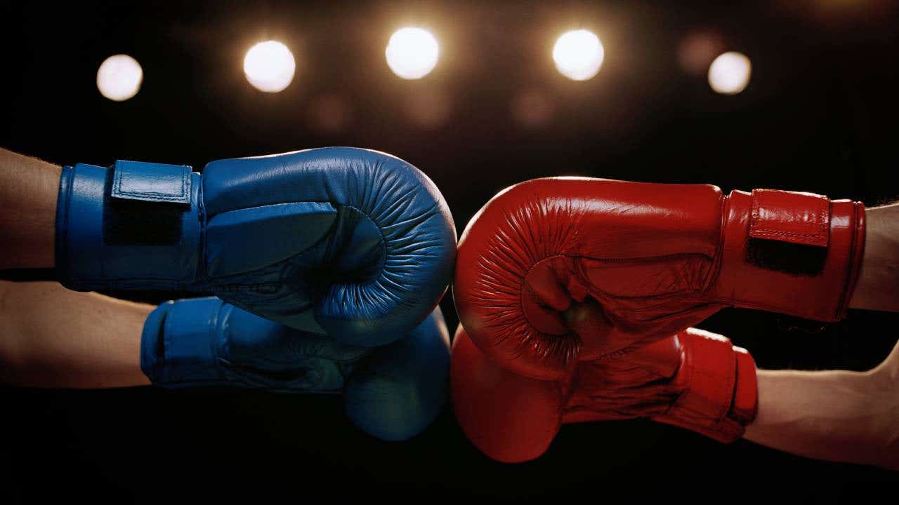 Two boxers touching gloves before a match.