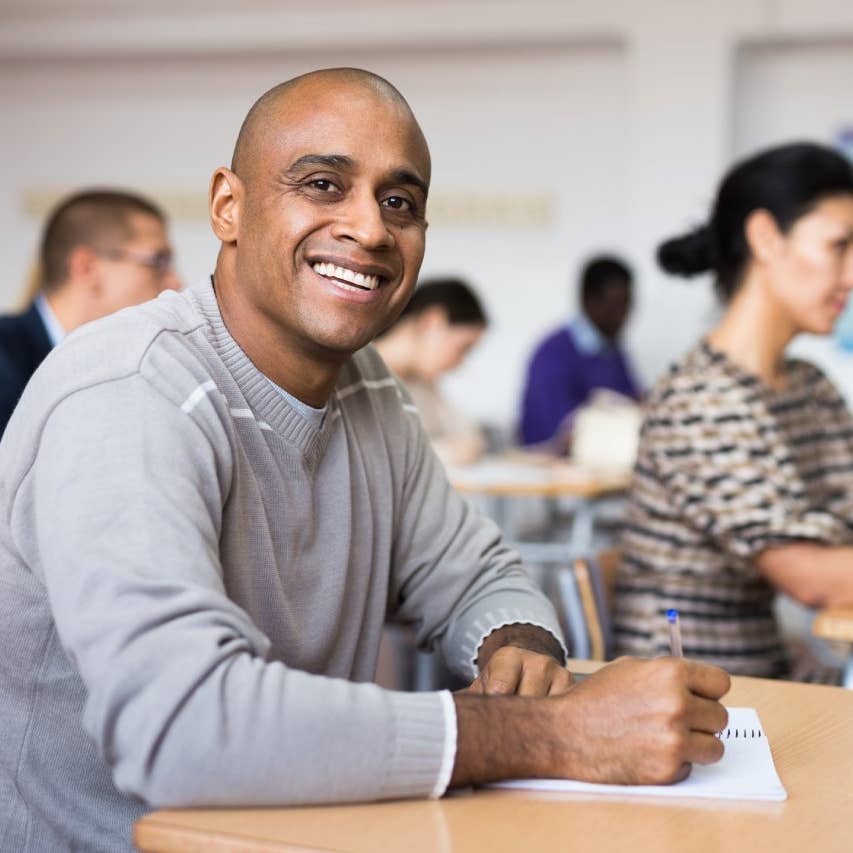 Group of students attentively listening to lecture in classroom