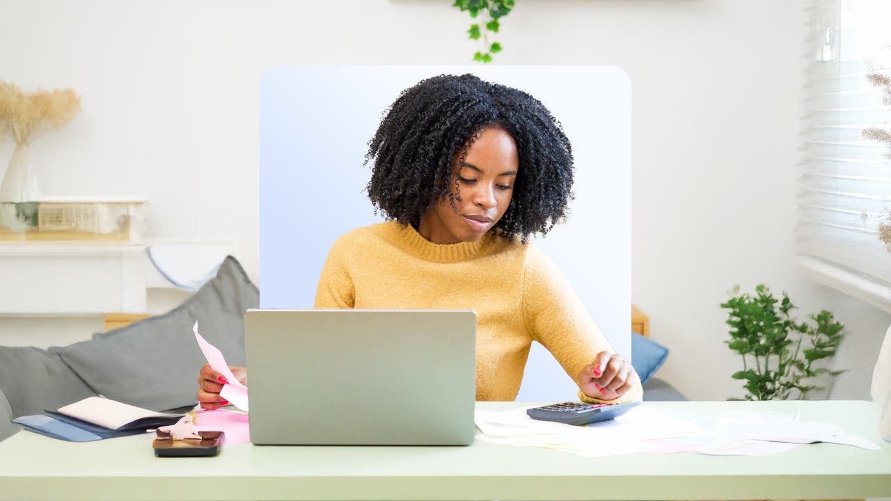 woman using a computer and calculator